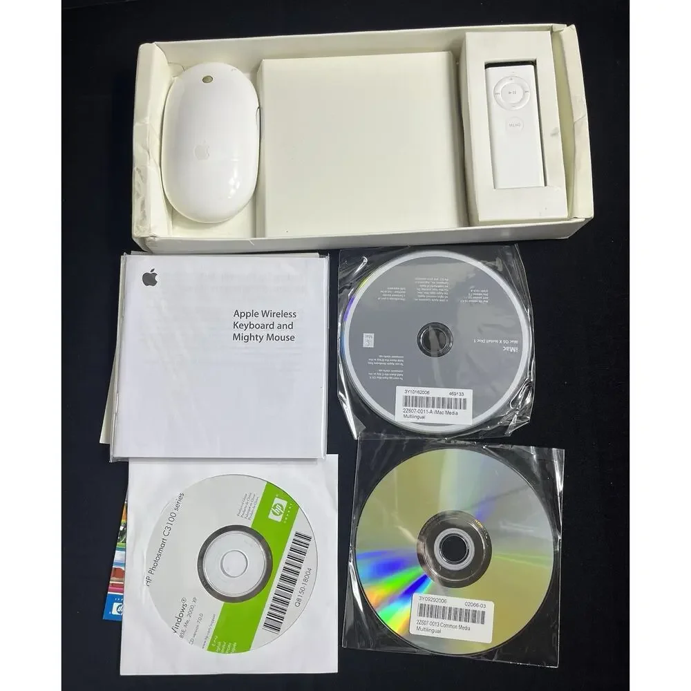 Apple A1197 mouse, A1156 Remote, OS X CDs. Sell As Is